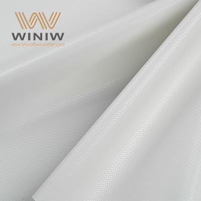 جلد صناعي من الألياف الدقيقة مُحسَّن للتحكم بالكرة لأسطح كرات القدم